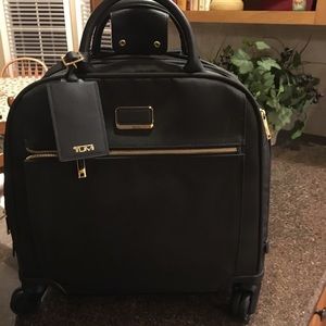 Tumi compact luggage.